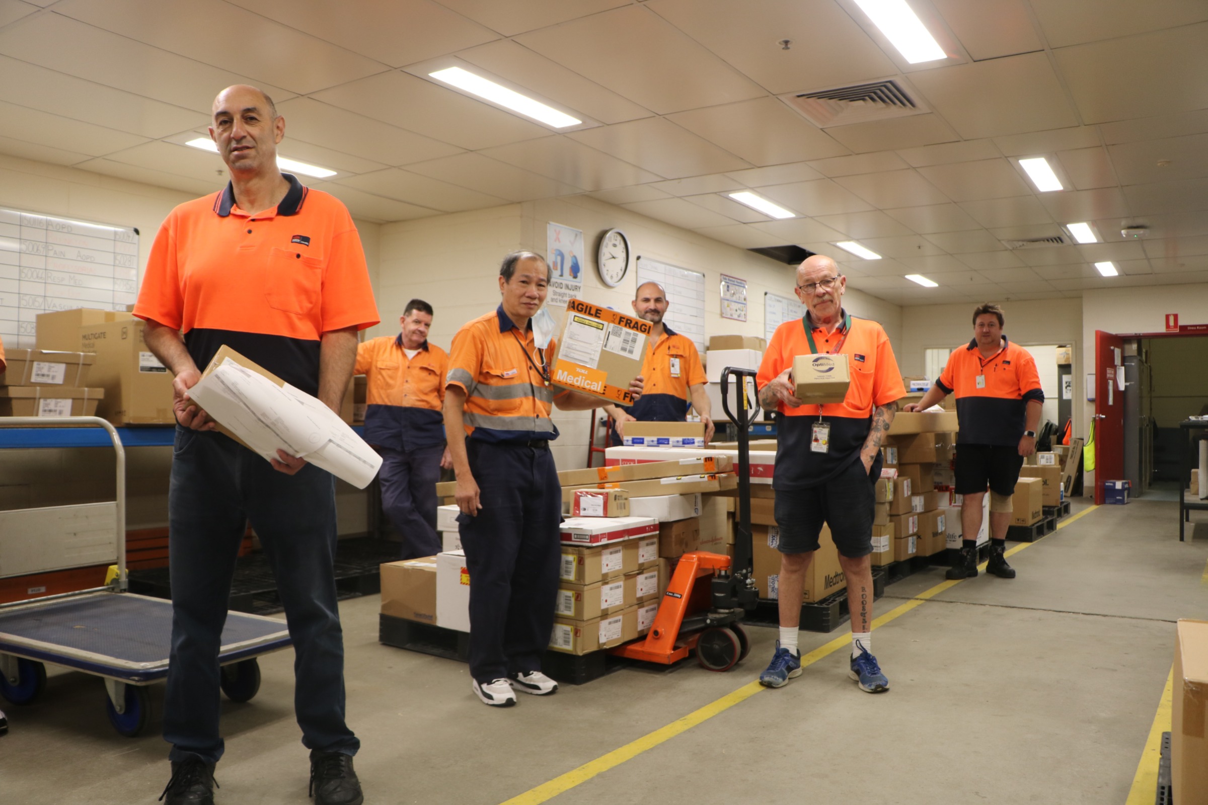 Dock, Goods and Stores staff holding mail and packages at Prince of Wales Hospital