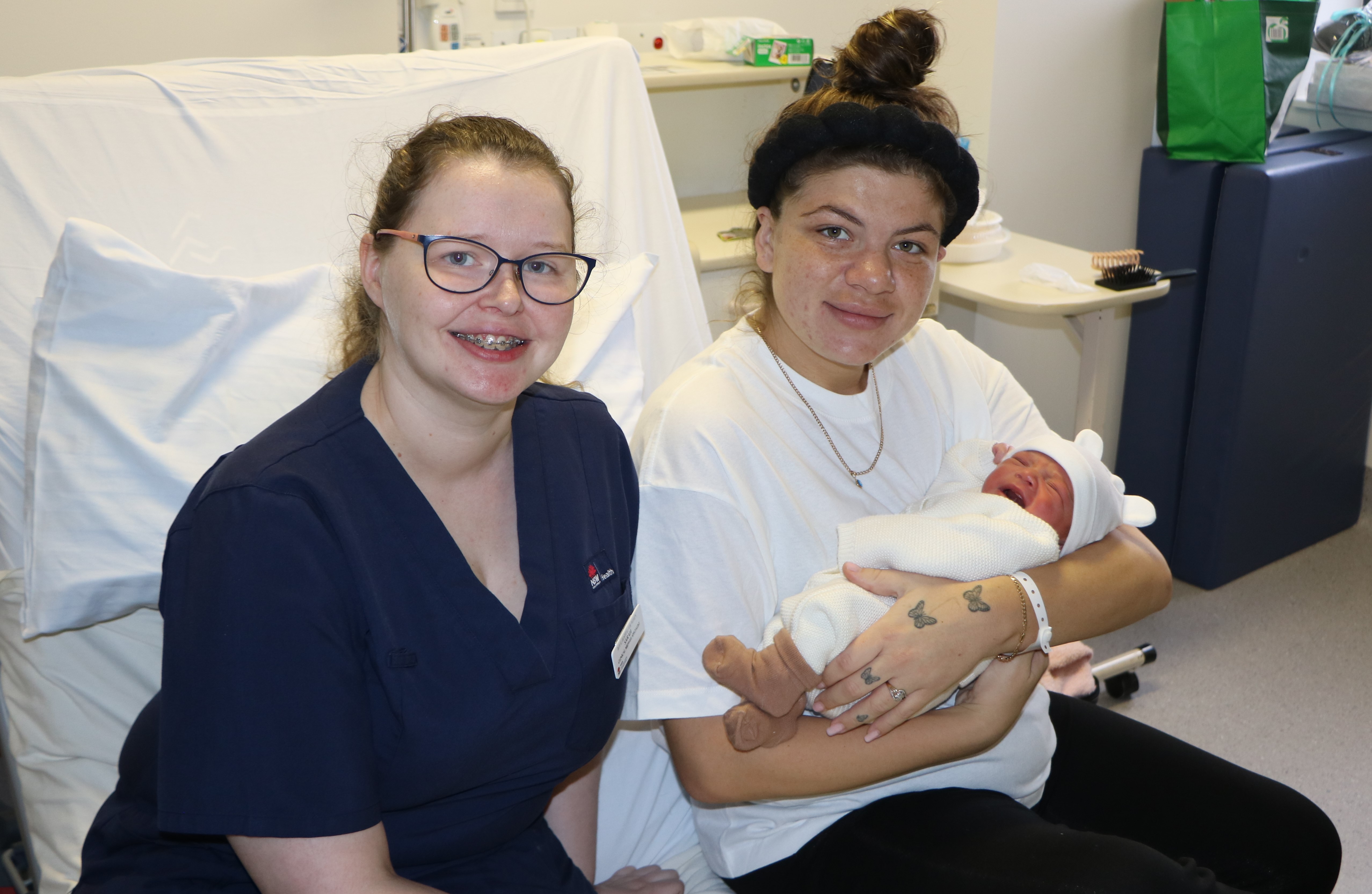 Midwife Sarah Whelan with mum and baby