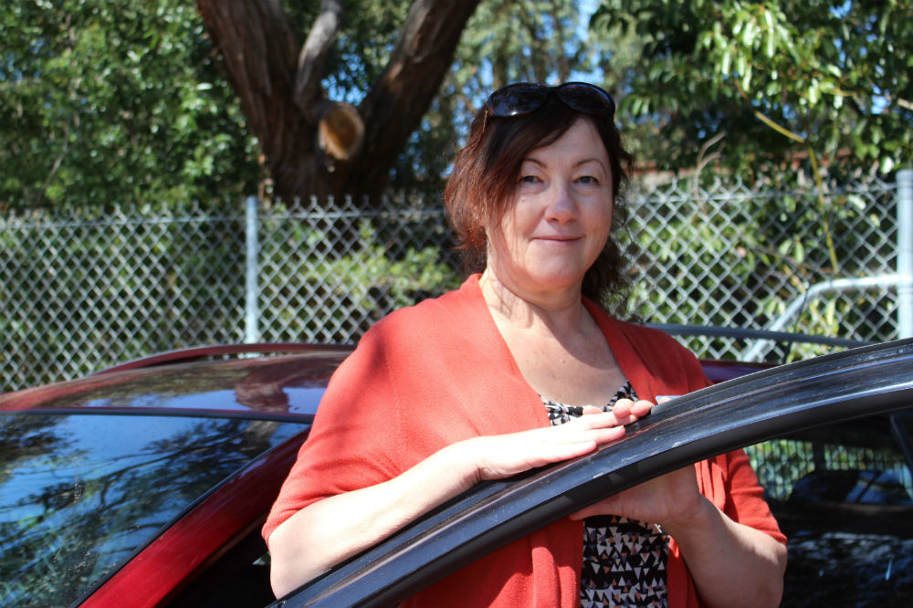 Lady leaning on car door