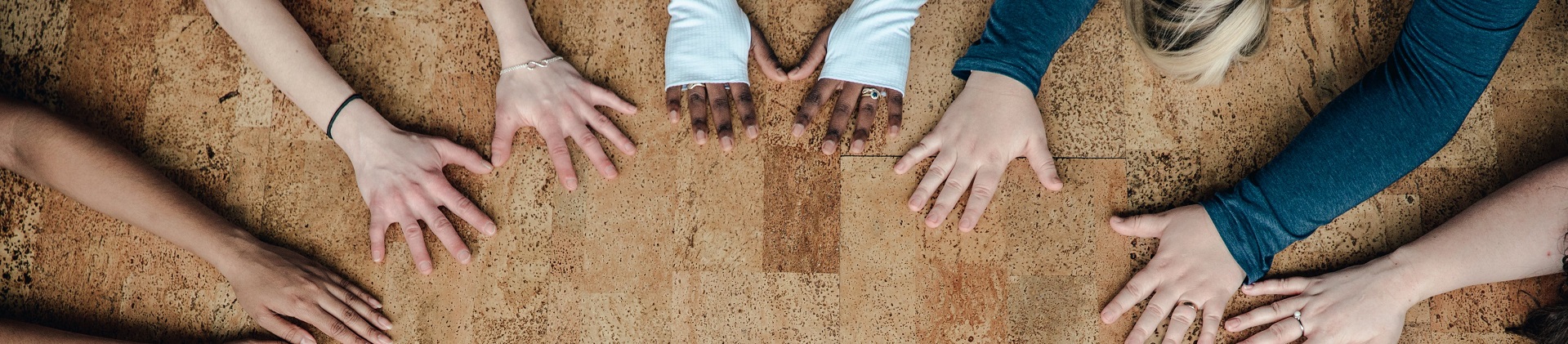 Women's hands forming a circle