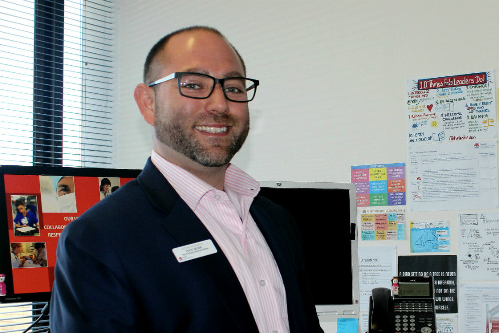 Smiling gentleman at desk