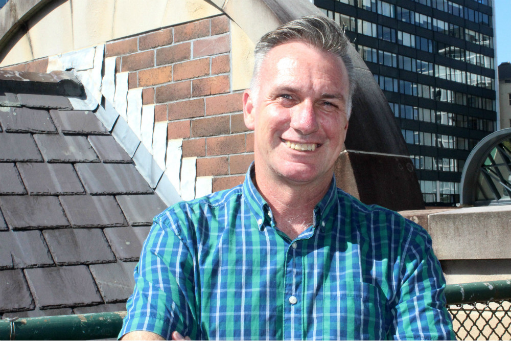 Smiling man on rooftop