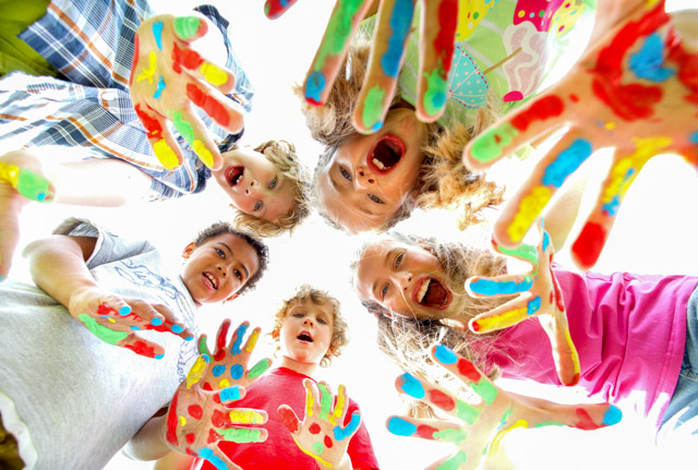 The picture of smiling kids with colourful hands. SESLHD PHU provides advice and support to early childhood facilities and childcare centres to help limit the spread of infections and respond to outbreaks