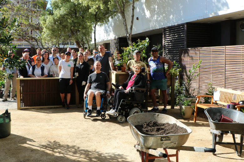 Large group of people standing in garden