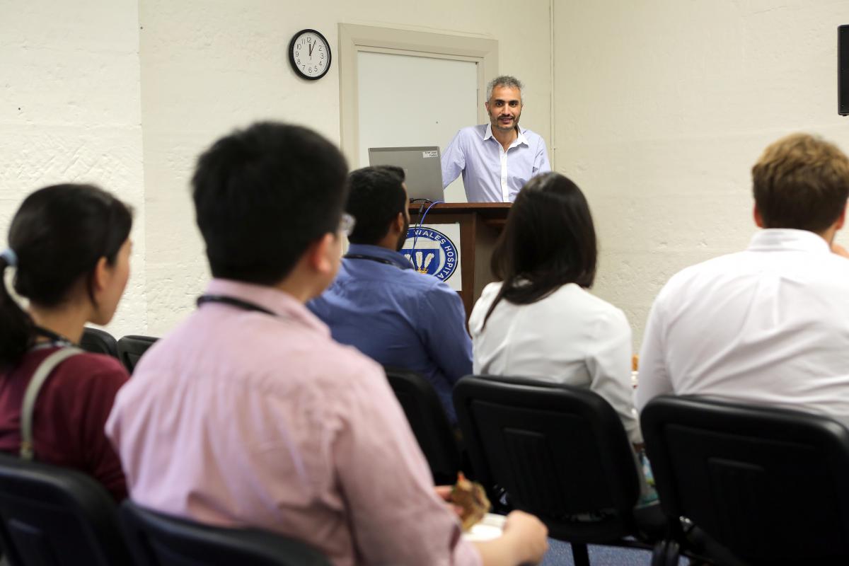 A speaker presenting to an audience