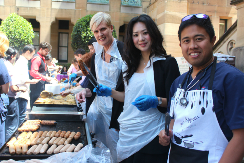 Hospital staff serving bbq lunch 