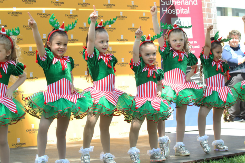 Young children performing on stage