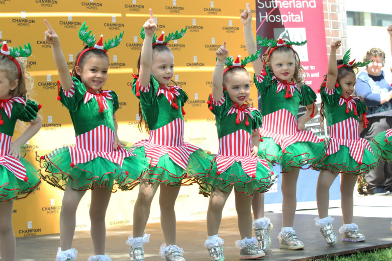 Young children performing on stage