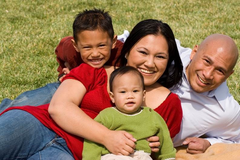 Smiling family of mum, dad and two kids