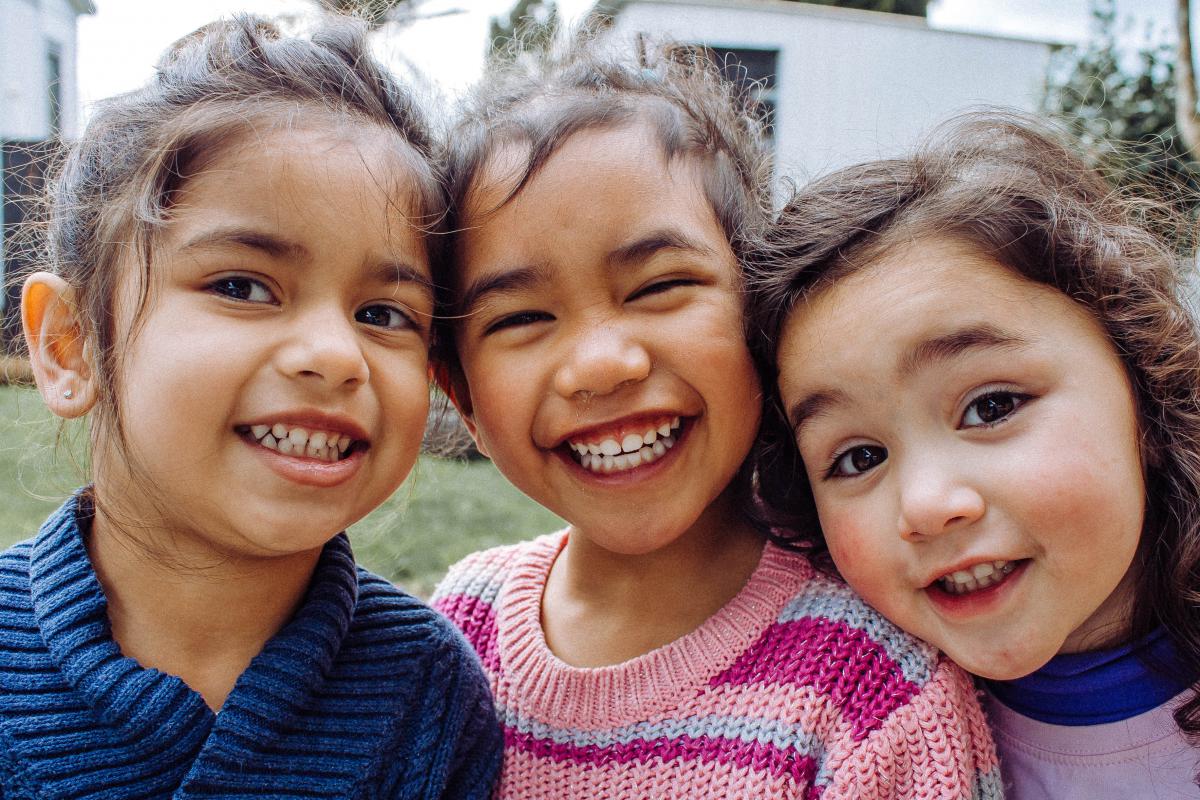 Three girls smiling