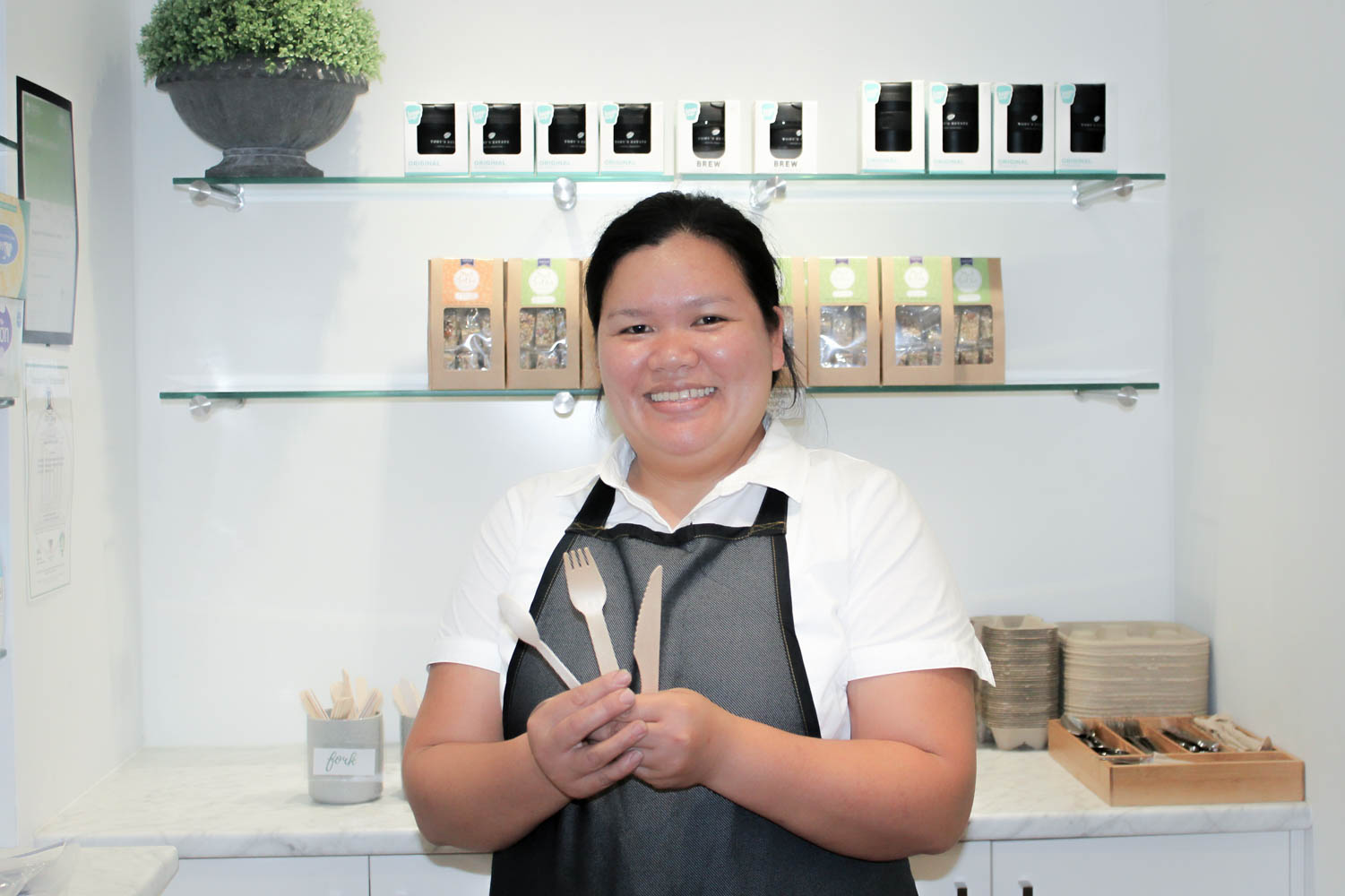 Jenny Abellera showcasing the bamboo cutlery offered by The Street Canteen