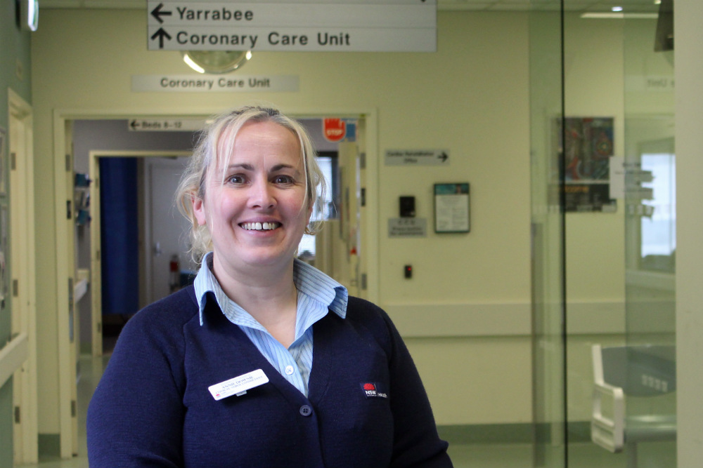 Nurse standing in hospital hallway