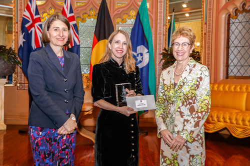 Professor Stephanie Watson holding her award alongside the NSW Premier, Gladys Berejiklian 