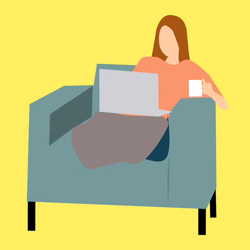 Woman sitting on couch with laptop