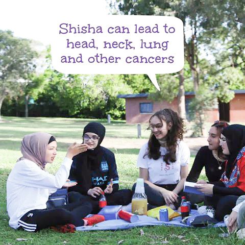 Young people having a picnic and discussing the negative impacts of shisha