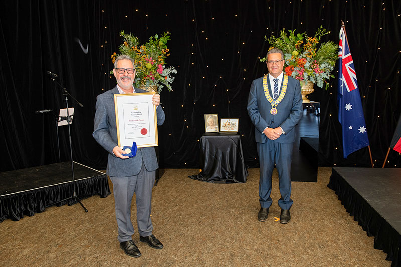 Randwick Mayor and Professor Mark Ferson holding his award