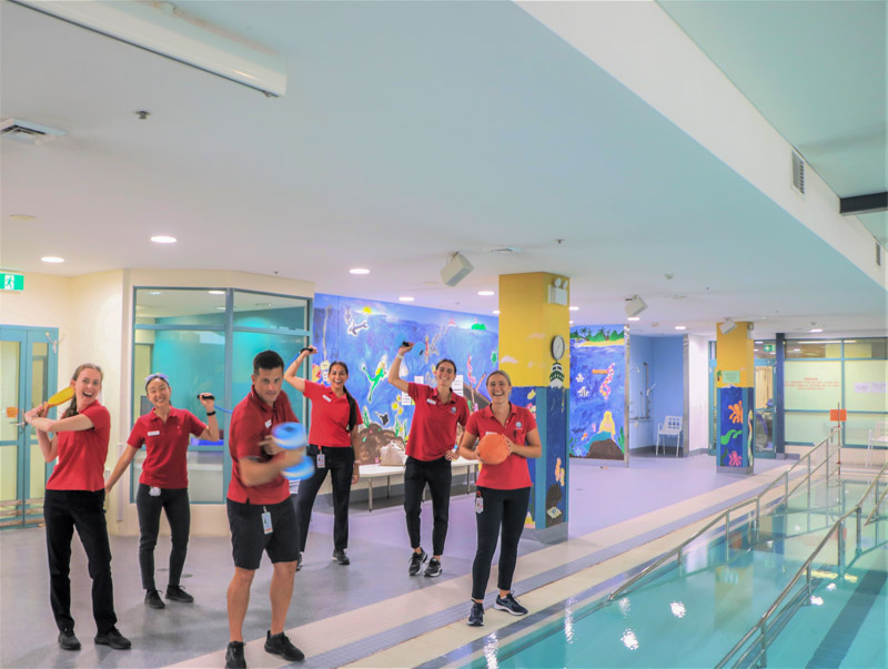Physiotherapy staff in front of pool
