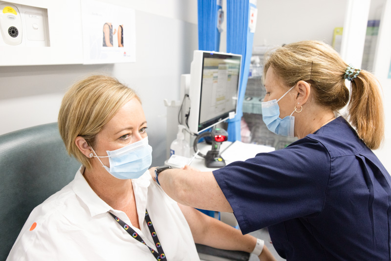 Staff member getting vaccine