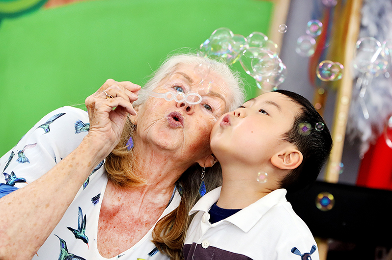 Diana and Maximillian blowing bubbles