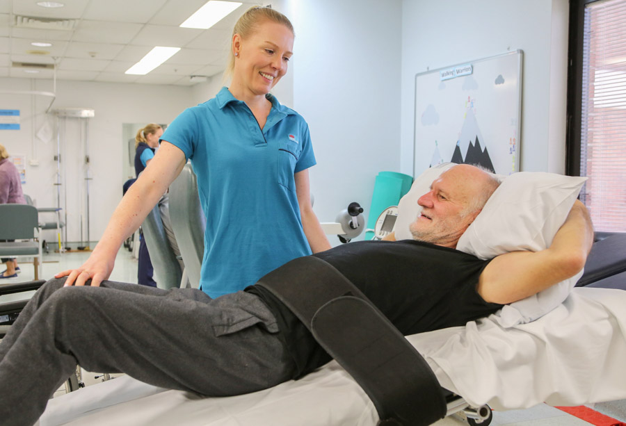 Giles diligently doing his rehabilitation exercises under the watchful eye of Lauren Stanwell