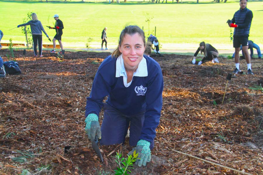 Dr Kate Charlesworth planting in Heffron Park, Maroubra