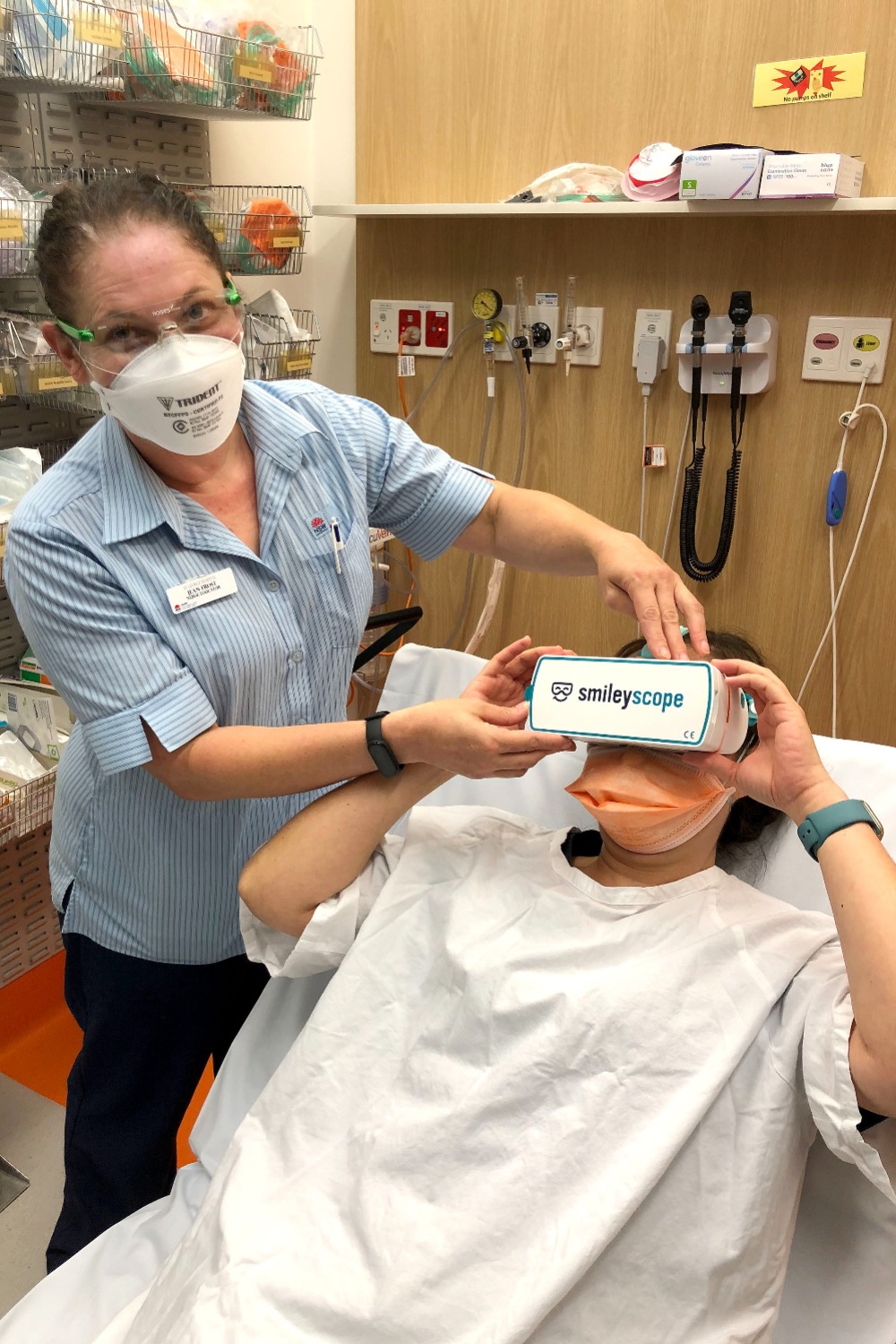 Staff and patient using the Smileyscope 