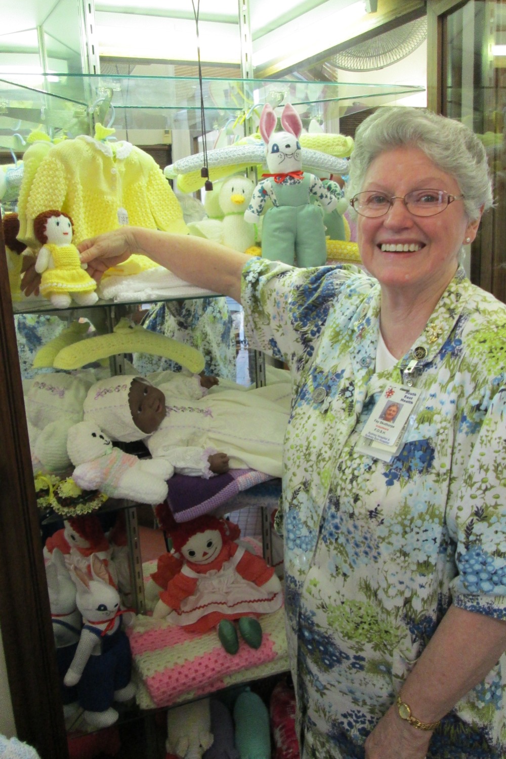 A volunteer - Fay Skuthorpe - in the Little Shop 