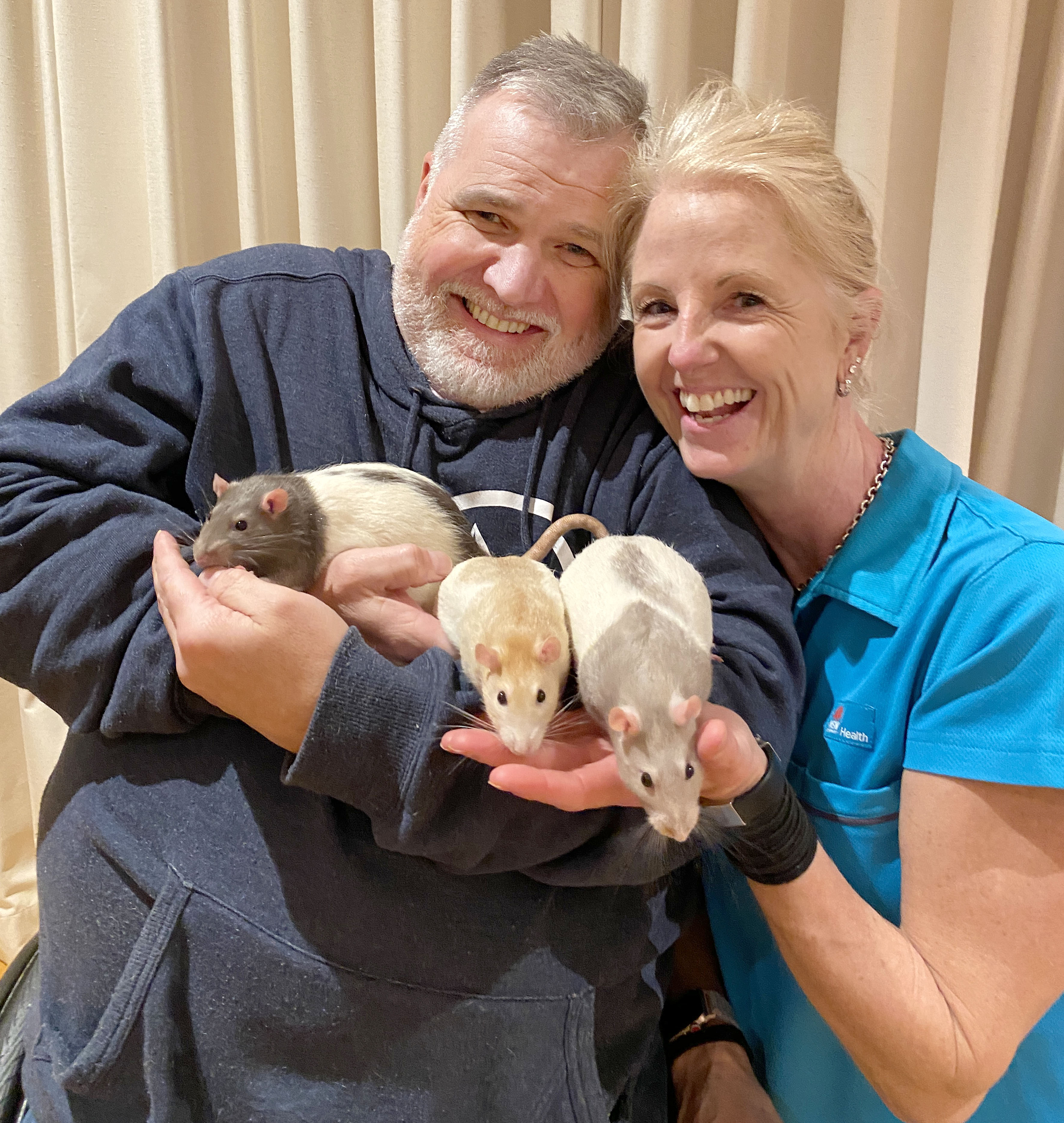 Jen Nicholls with her husband Chris and their pet rats 