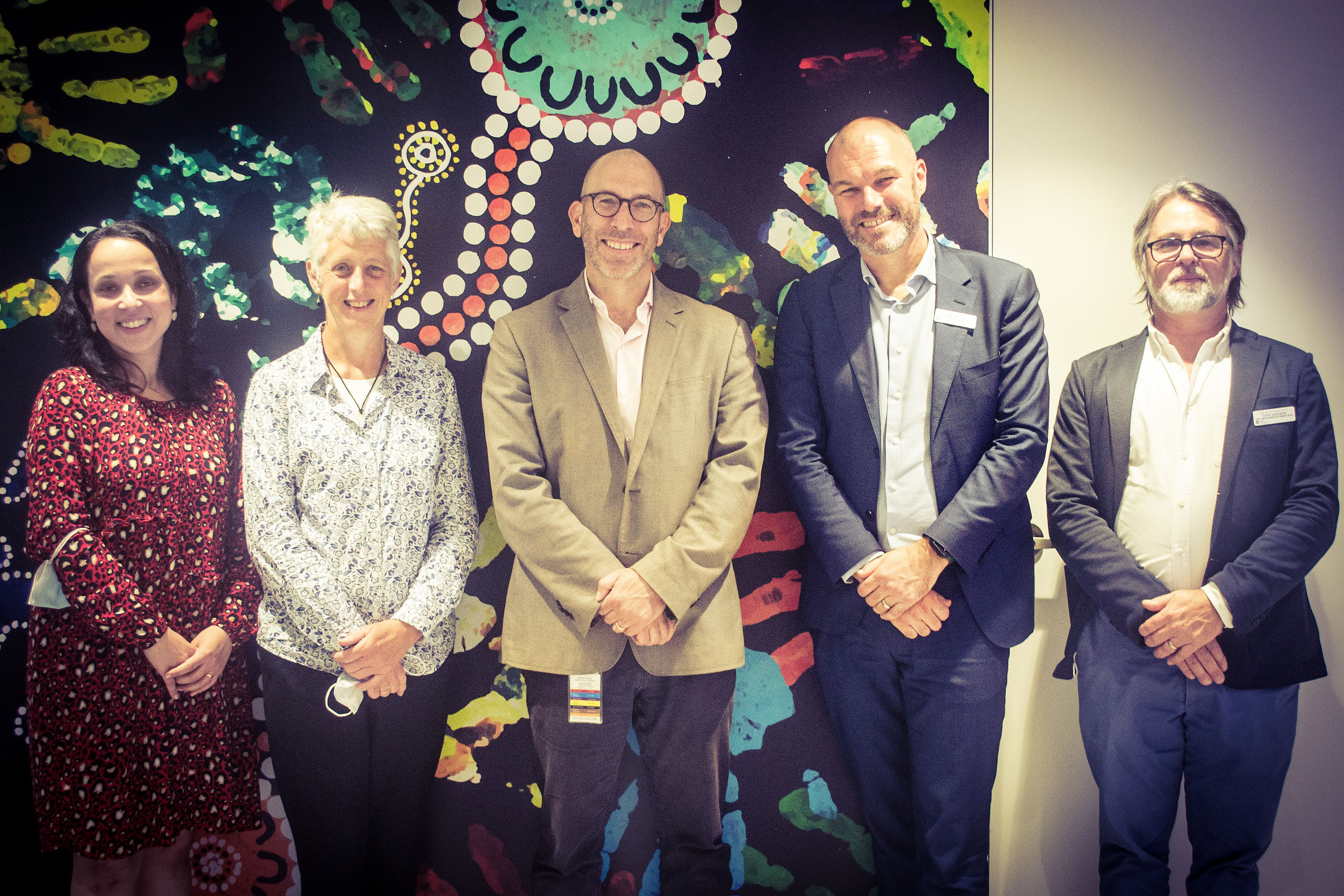 Group of five managers at new premises