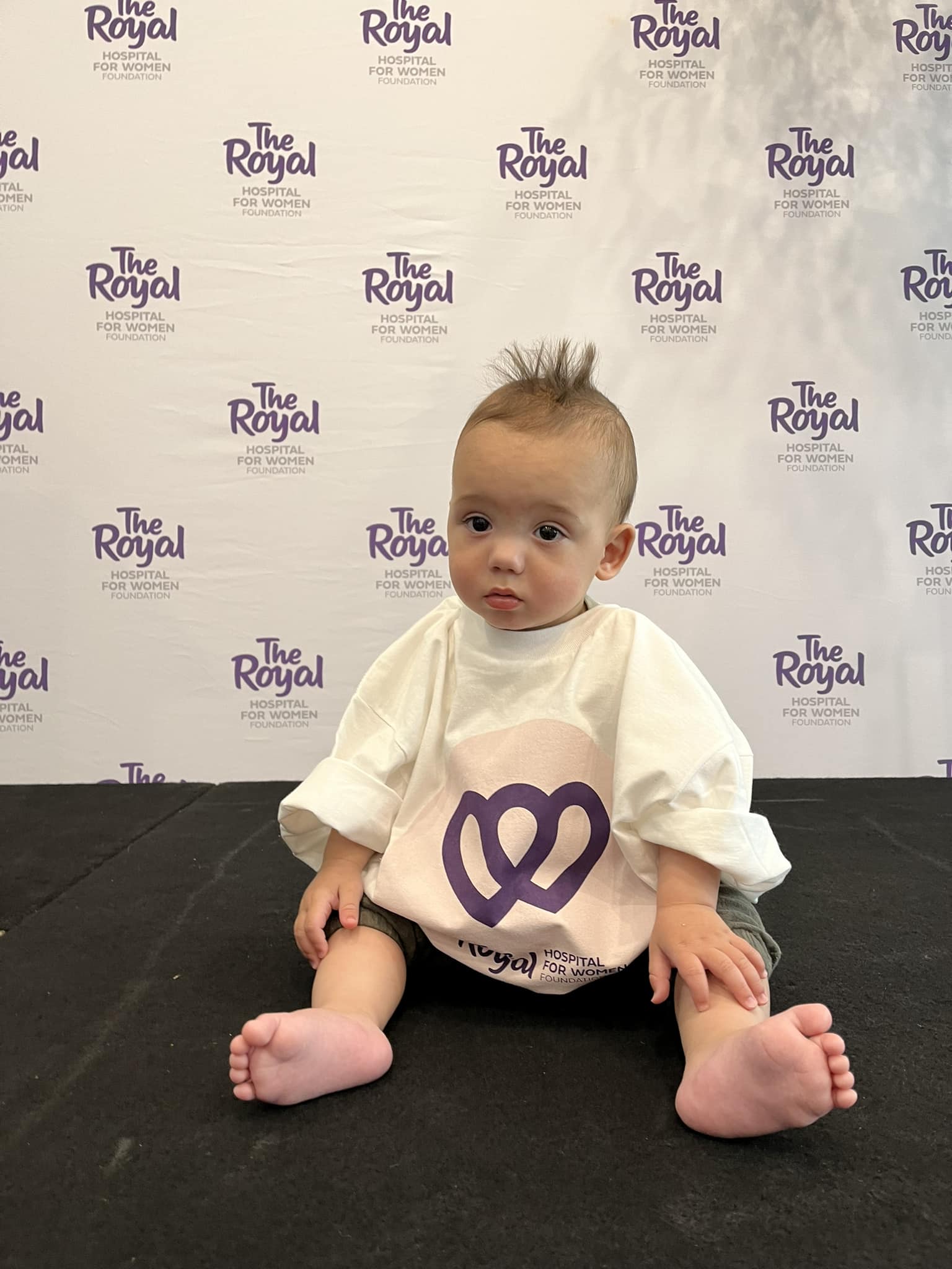 Baby wearing Giving Day t-shirt