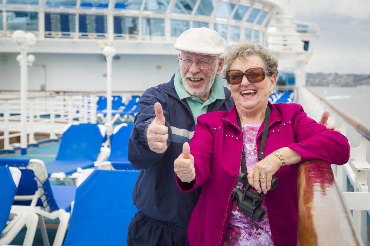 A couple enjoying themselves on a cruise ship. Cruise ships have become a popular mode of holiday travel, attracting large numbers of people from all over the world. Staying healthy while travelling is important to make the most of your trip