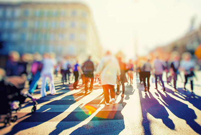 People crossing a crowded street