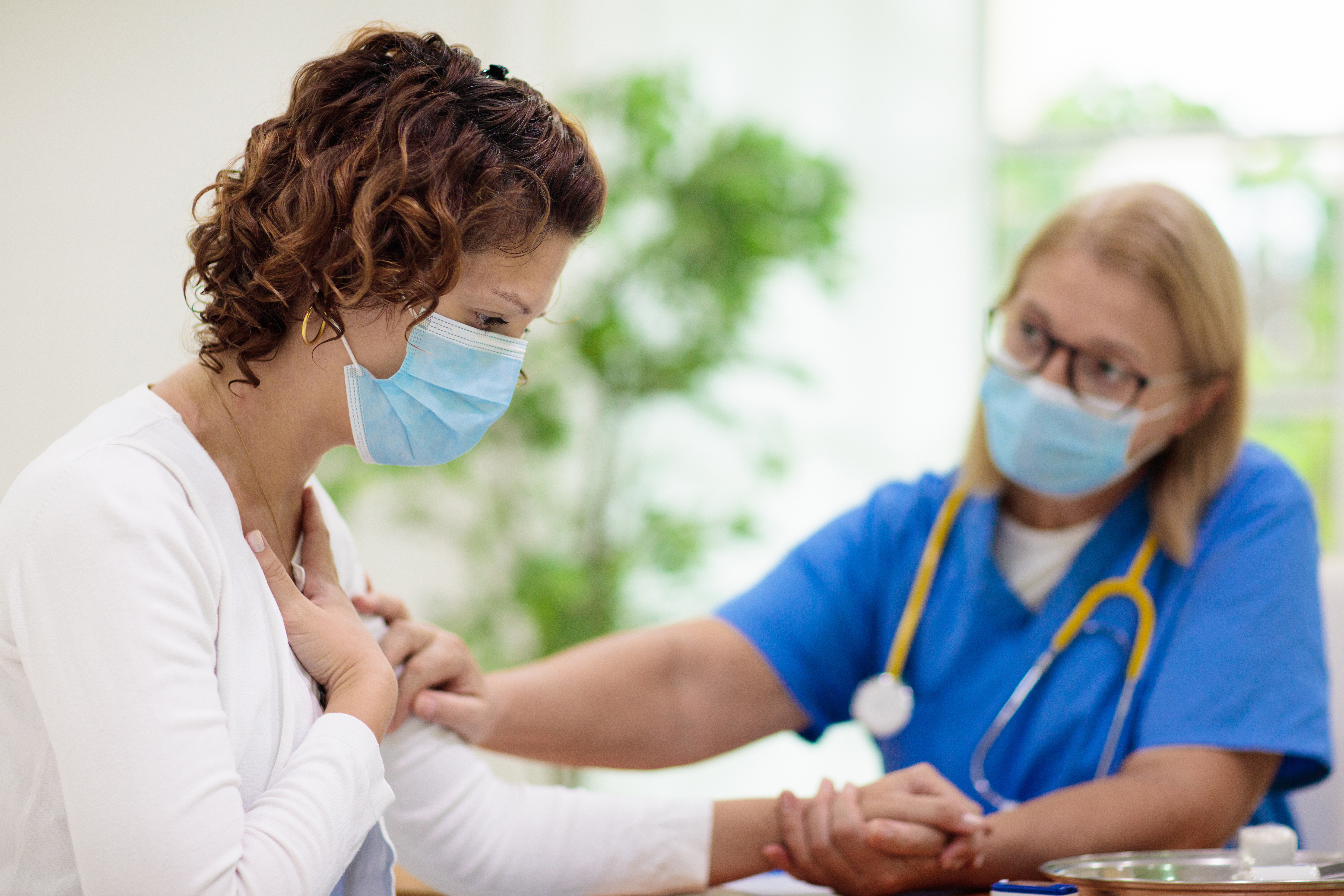 Nurse speaking with female patient