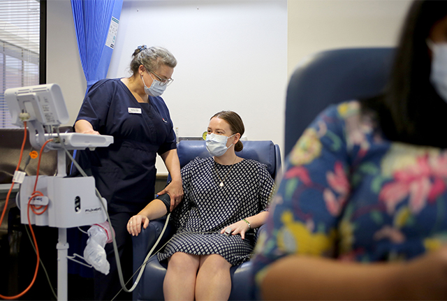 Nurse taking patient's blood pressure