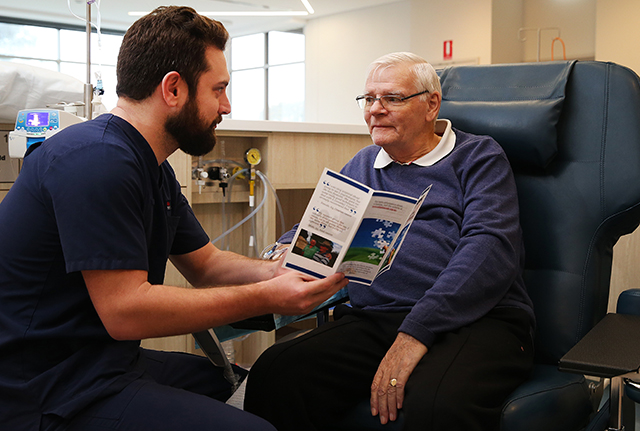 Nurse speaking with male patient