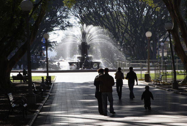 A silhouette of people in Sydney's Hyde Park