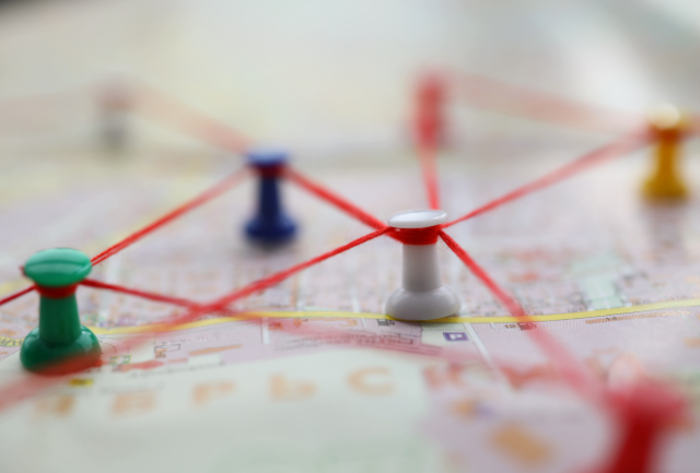Map with pins and string in it