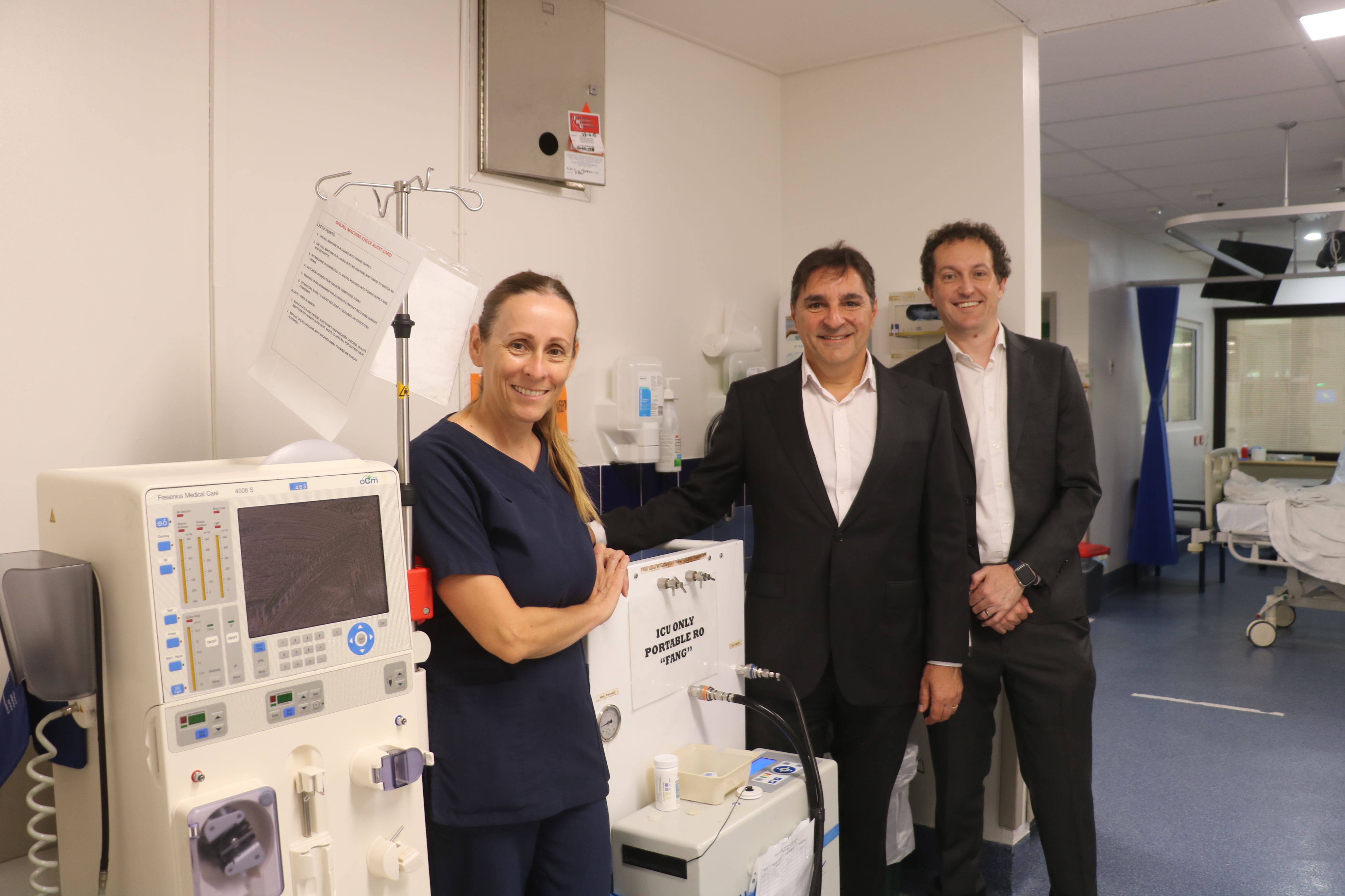 Members of the renal medicine team by dialysis water filter