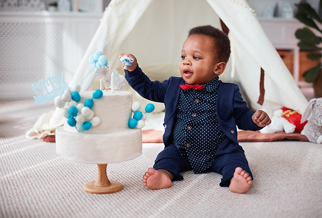 Baby with a Birthday Cake