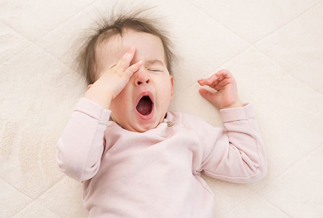 Sleep (responsive settling) - a baby yawning