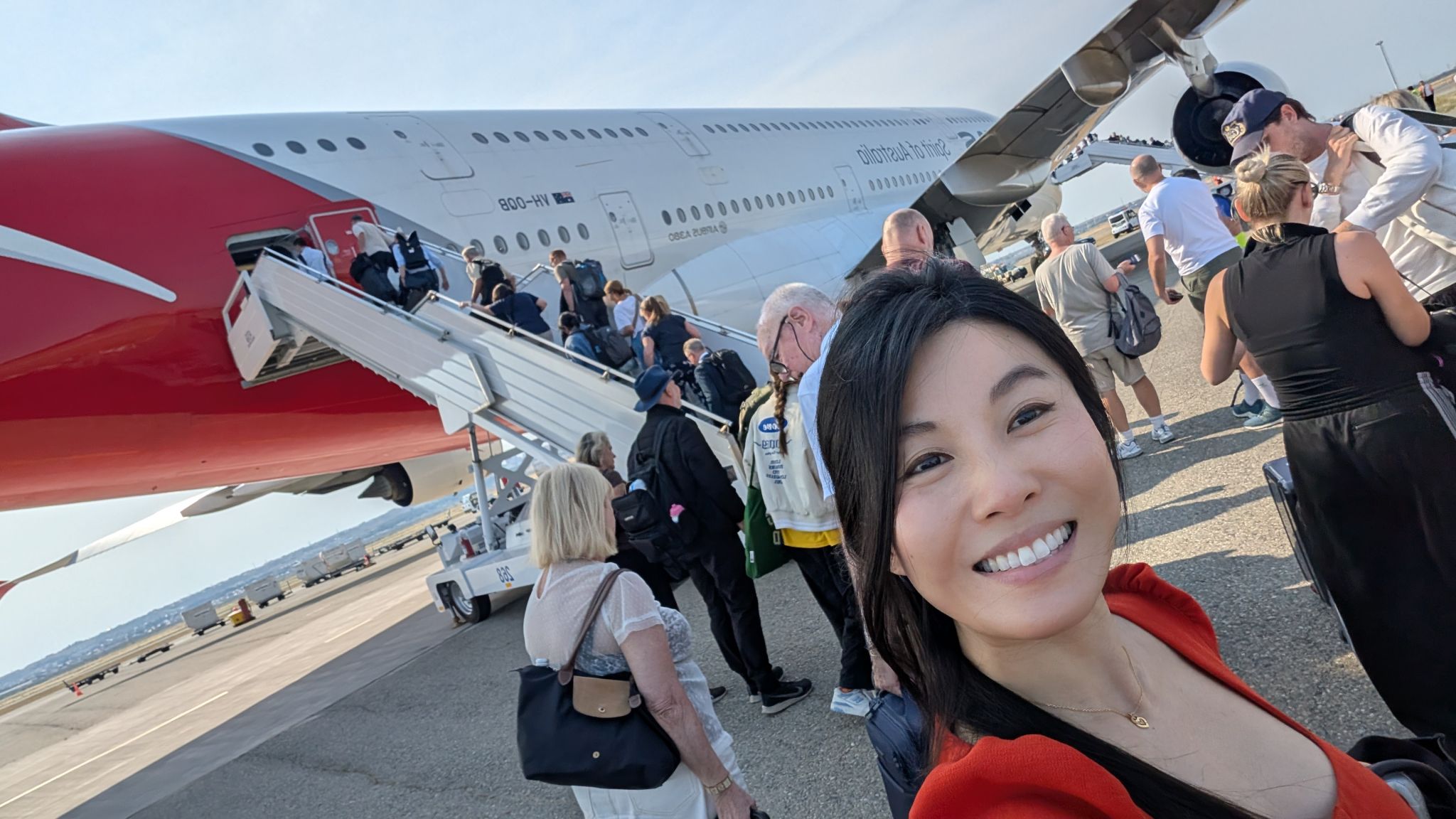 Tanya Trinh at Baku airport in Azerbaijan with the aircraft in the background