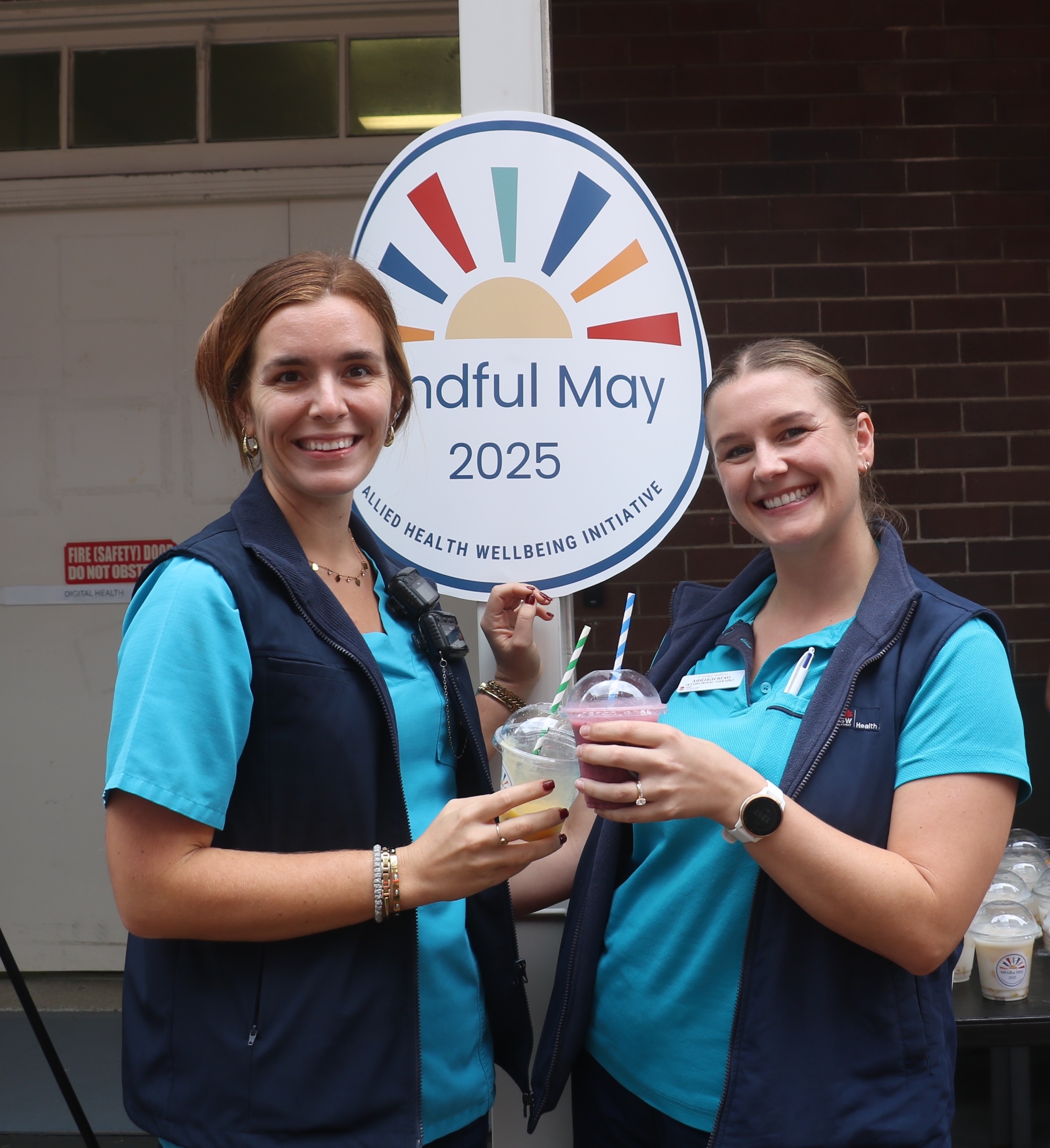 Allied Health Staff with Mindful May signage