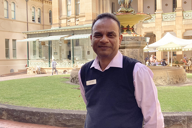 Gentleman standing in front of fountain at Sydney Hospital