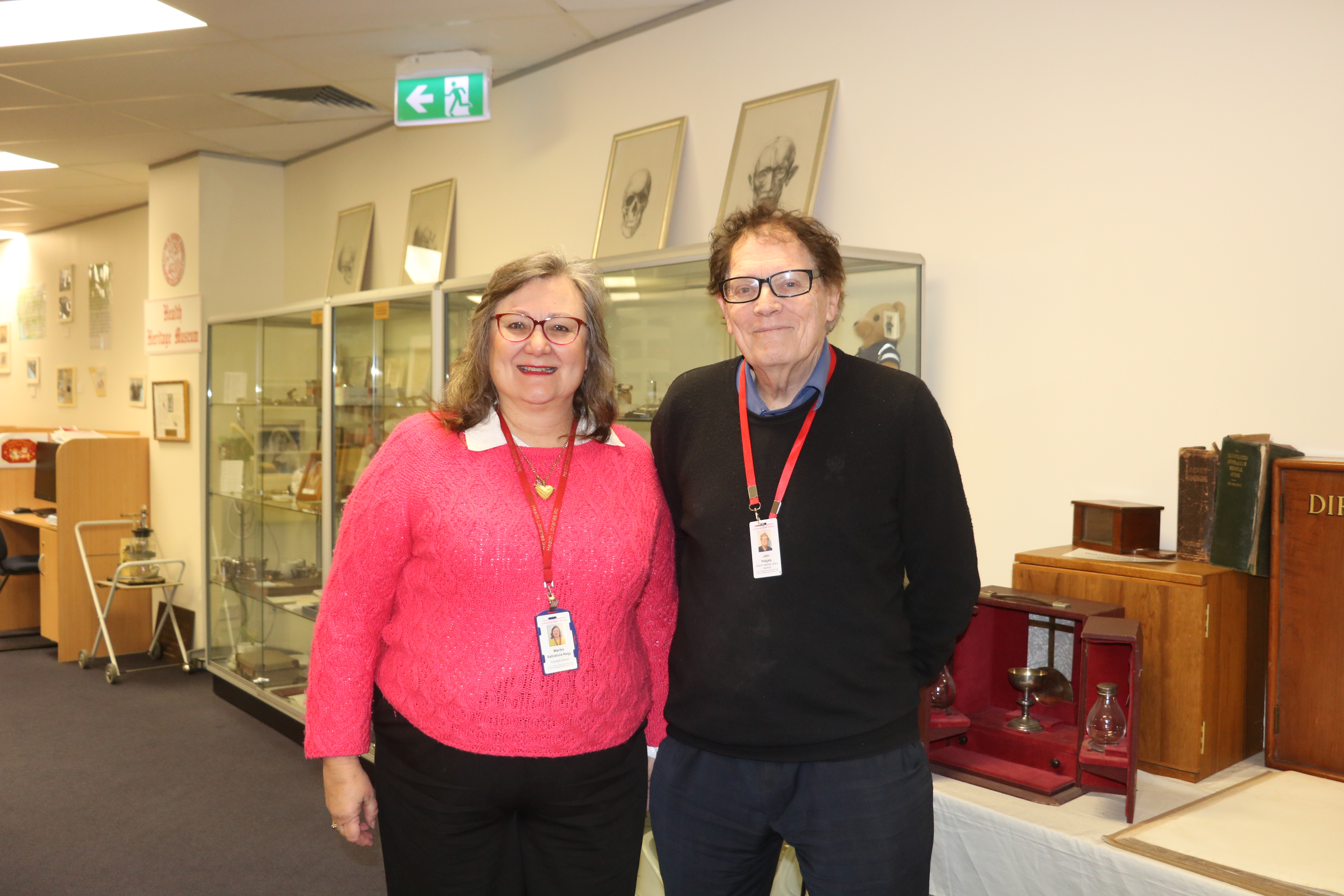 Librarian Maria Sablatura-Nagy and Library Director John Holgate