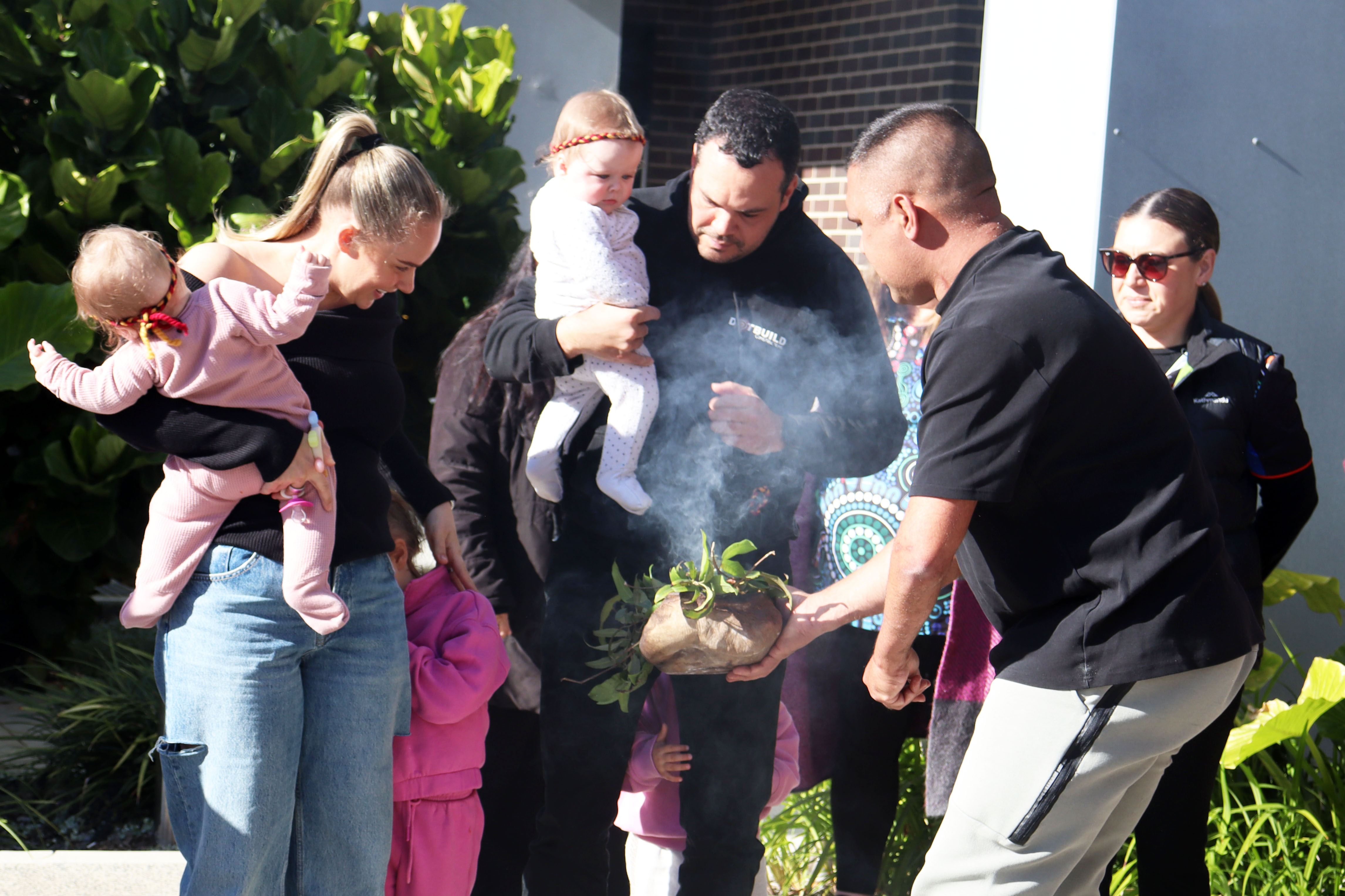 Smoking ceremony with mums and babies