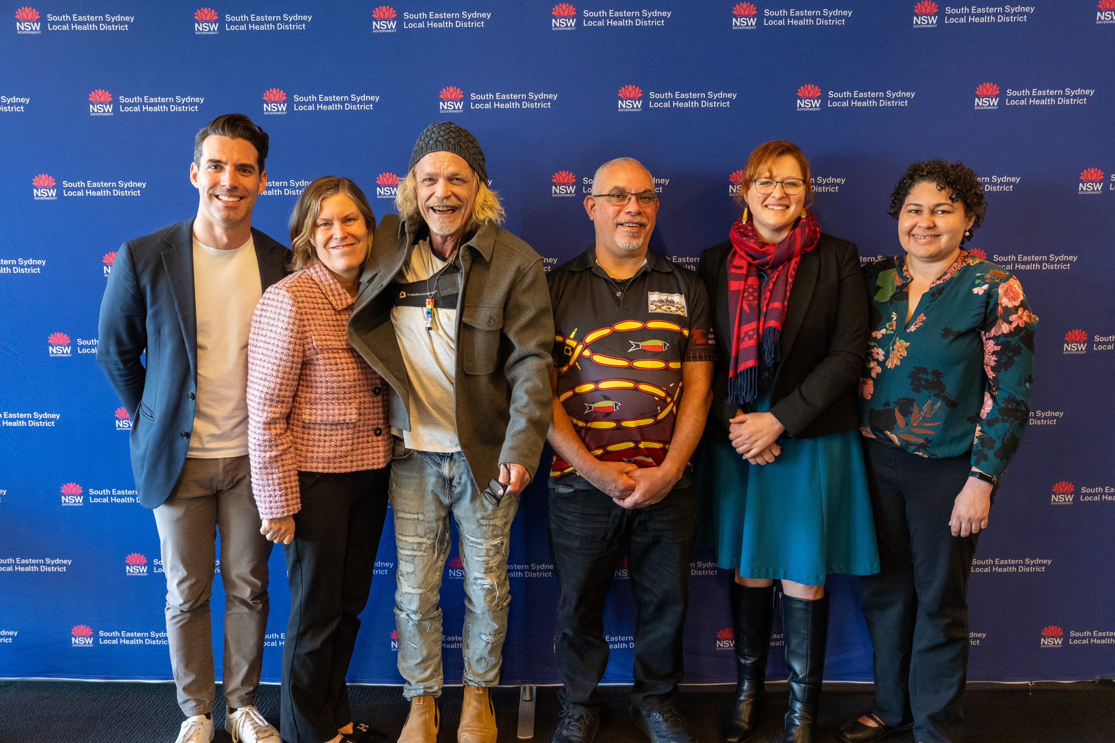 Group of six people smiling