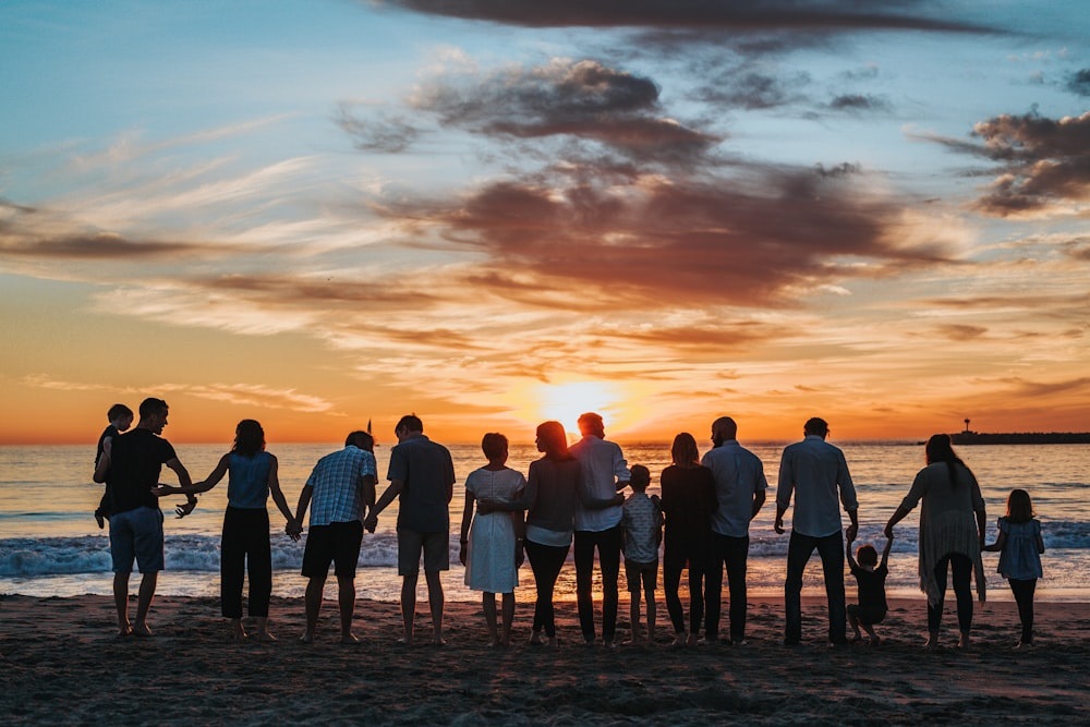 family and community looking at sunset