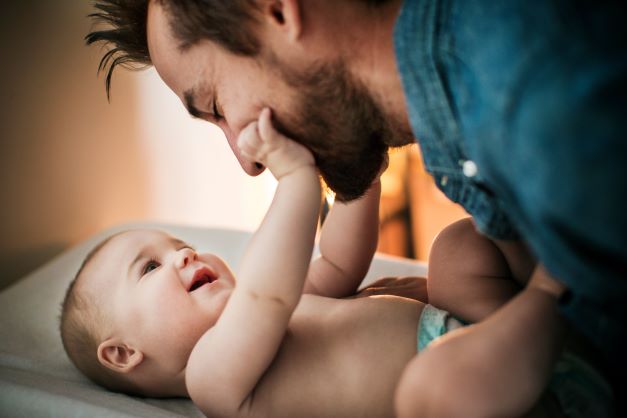Baby smiling at dad