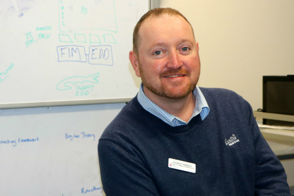 Andrew Murray in front of whiteboard