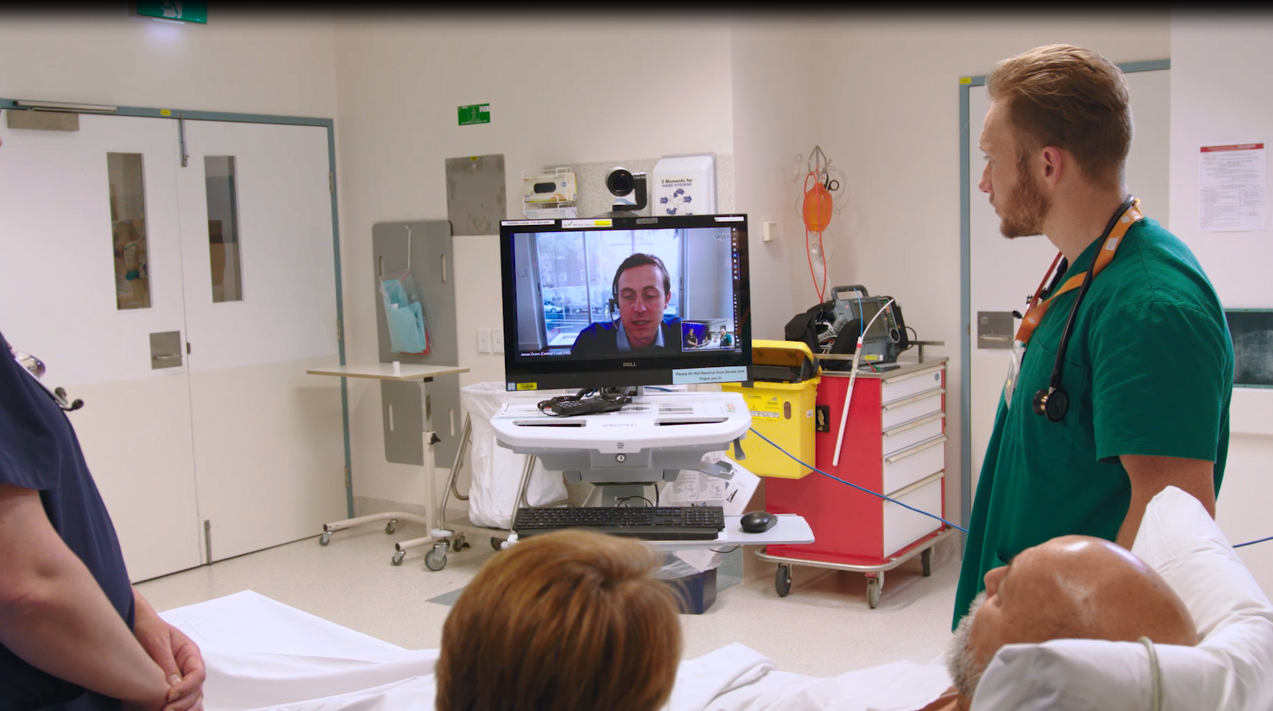 Patient and staff receiving care via videoconference